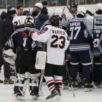 The SoHi and Kenai Central hockey teams meet at center ice to pray for the Clyde family after the game on Thursday, Dec. 16, 2022, at the Kenai Multi-Purpose Facility in Kenai, Alaska. Tanner Clyde, a SoHi goalie, lost his father to a fatal car collision earlier this week. (Photo courtesy Rylie Thompson)
