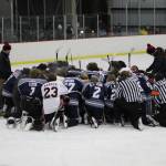 The SoHi and Kenai Central hockey teams meet at center ice to pray for the Clyde family after the game on Thursday, Dec. 16, 2022, at the Kenai Multi-Purpose Facility in Kenai, Alaska. Tanner Clyde, a SoHi goalie, lost his father to a fatal car collision earlier this week. (Photo courtesy Rylie Thompson)