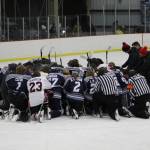 The SoHi and Kenai Central hockey teams meet at center ice to pray for the Clyde family after the game on Thursday, Dec. 16, 2022 at the Kenai Multi-Purpose Facility in Kenai, Alaska. Tanner Clyde, a SoHi goalie, lost his father to a fatal car collision earlier this week. (Photo courtesy Rylie Thompson)