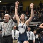 Soldotnas Trinity Donovan celebrates becoming the third girls in Alaska history to win four state wrestling titles Saturday, Dec. 18, 2022, at the state wrestling tournament at the Alaska Airlines Center in Anchorage, Alaska. (Photo by Jeff Helminiak/Peninsula Clarion)