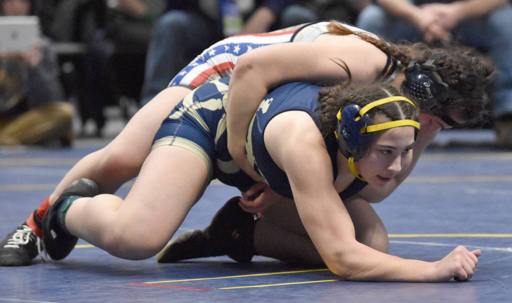 Homers Roane Cook defeats North Poles Lylah Murrah for the Girls state title at 185 pounds Saturday, Dec. 18, 2022, at the state wrestling tournament at the Alaska Airlines Center in Anchorage, Alaska. (Photo by Jeff Helminiak/Peninsula Clarion)