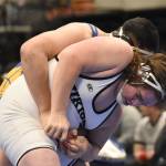 Nikiskis Mayaac Schmit scores an escape on Barrows Uatahouse Tuifua before losing the Division II state title match Saturday, Dec. 18, 2022, at the state wrestling tournament at the Alaska Airlines Center in Anchorage, Alaska. (Photo by Jeff Helminiak/Peninsula Clarion)