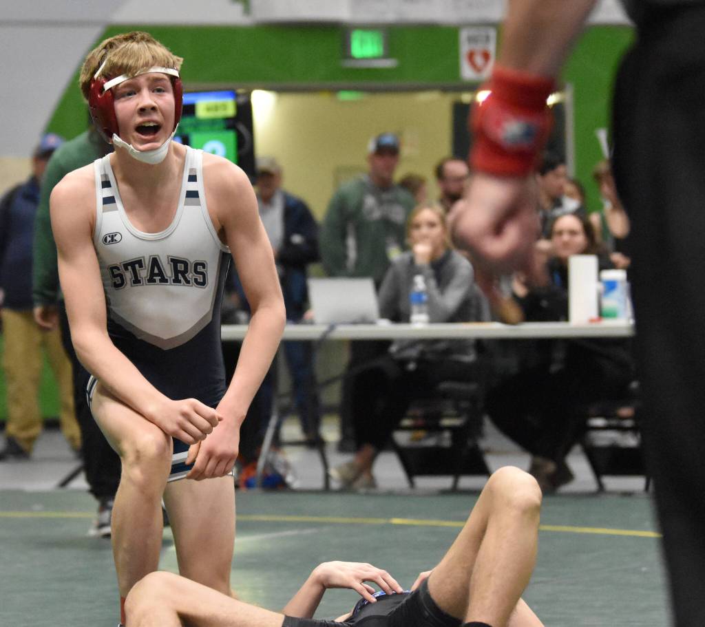 Soldotnas Jacob Strausbaugh celebrates winning the Division I state title at 112 pounds Saturday, Dec. 18, 2022, at the state wrestling tournament at the Alaska Airlines Center in Anchorage, Alaska. (Photo by Jeff Helminiak/Peninsula Clarion)