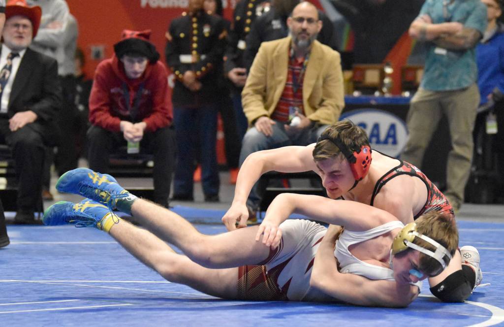 Kenai Centrals Owen Whicker defeats Grace Christians Colton Merriner for the Division II state title at 135 pounds Saturday, Dec. 18, 2022, at the state wrestling tournament at the Alaska Airlines Center in Anchorage, Alaska. (Photo by Jeff Helminiak/Peninsula Clarion)