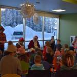 Children fill the Kid Zone during Story Time with Mrs. Claus at the Kenai Community Library in Kenai, Alaska, on Monday, Dec. 19, 2022. (Jake Dye/Peninsula Clarion)