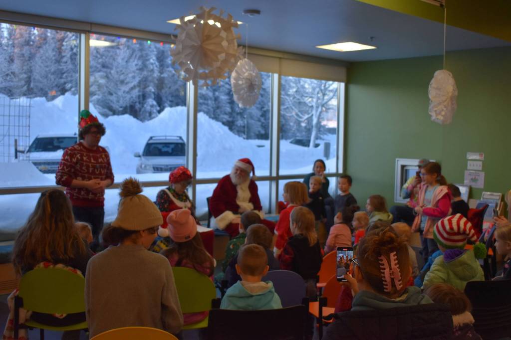 Children fill the Kid Zone during Story Time with Mrs. Claus at the Kenai Community Library in Kenai, Alaska, on Monday, Dec. 19, 2022. (Jake Dye/Peninsula Clarion)