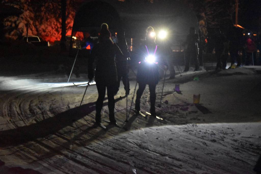 Skiiers take off down the trail during StarLight StarBright: A Winter Solstice Ski Event on Wednesday, Dec. 21, 2022 at the Kenai Golf Course in Kenai, Alaska.