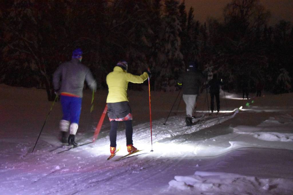 Skiiers take off down the trail during StarLight StarBright: A Winter Solstice Ski Event on Wednesday, Dec. 21, 2022 at the Kenai Golf Course in Kenai, Alaska.