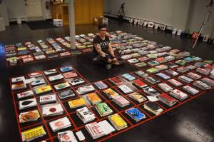 Jake Dye / Peninsula Clarion 
Diane Dunn sits, surrounded by 2,000 journals she made and painted by hand, on Tuesday, ahead of the opening of 2000 Journals: Filling the Void at the Kenai Art Center.