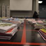 Stacks of journals cover a large space of the floor on Tuesday, Jan. 3, 2023, ahead of the opening of Diane Dunns 2000 Journals: Filling the Void at the Kenai Art Center in Kenai, Alaska. (Jake Dye/Peninsula Clarion)