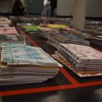 Stacks of journals cover a large space of the floor on Tuesday, Jan. 3, 2023, ahead of the opening of Diane Dunns 2000 Journals: Filling the Void at the Kenai Art Center in Kenai, Alaska. (Jake Dye/Peninsula Clarion)