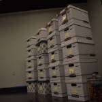 Boxes which were once filled with 2000 journals sit empty on Tuesday, Jan. 3, 2023, ahead of the opening of Diane Dunns 2000 Journals: Filling the Void at the Kenai Art Center in Kenai, Alaska. (Jake Dye/Peninsula Clarion)