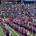 Cheerleaders, including members of the Kenai Central High School Cheerleading team, stand with hands on their hips during the pre-show performance at the Cheez-It Citrus Bowl on Monday, Jan. 1, 2023 at Camping World Stadium in Orlando, Florida. (Photo courtesy Sabrina McGraw)