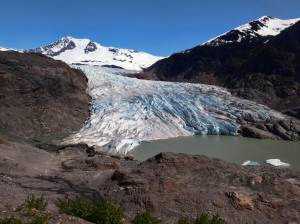 Chunks of ice float on Mendenhall Lake in front of the Mendenhall Glacier on Monday, May 30, 2022, in Juneau, Alaska. A study of all of the worlds 215,000 glaciers published on Thursday, Jan. 5, 2023, finds even if with the unlikely minimum warming of only a few tenths of a degrees more, the world will lose nearly half its glaciers by the end of the century. With the warming were now on track to get, the world will lose two-thirds of its glaciers and overall glacier mass will drop by one-third while sea level rises 4.5 inches just from melting glaciers. (AP Photo/Becky Bohrer)