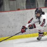 Kenai Central's Logan Mese keeps the puck from Colony's Carsen Lantto on Thursday, Jan. 5, 2023, at the Kenai Multi-Purpose Facility in Kenai, Alaska. (Photo by Jeff Helminiak/Peninsula Clarion)