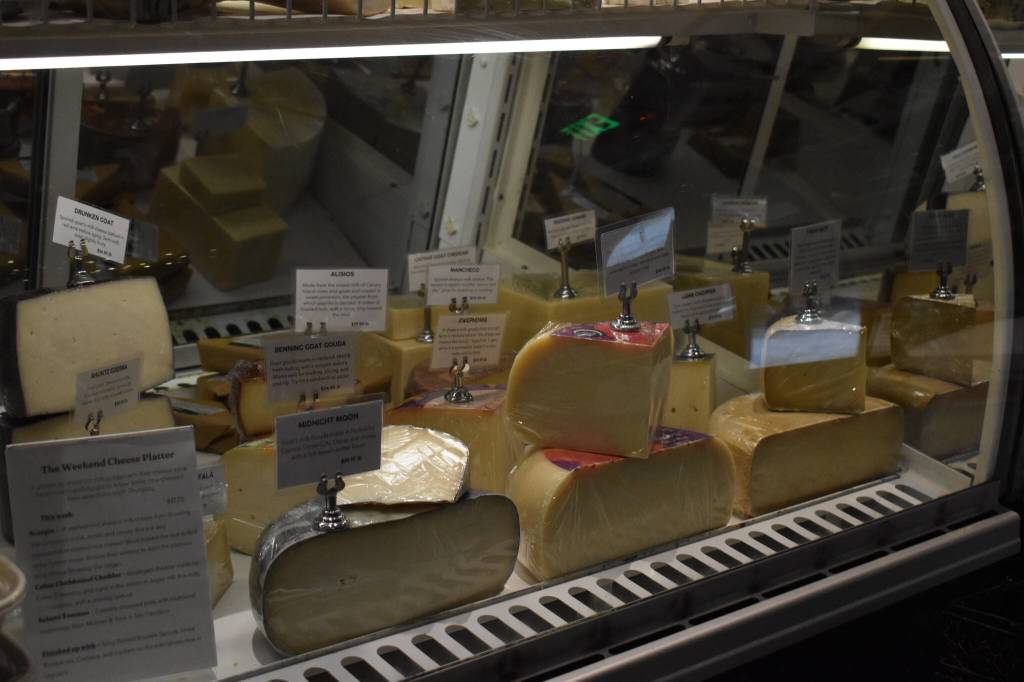 Artisanal cheeses are on display on Friday, Jan. 6, 2023 at Lucys Market in Soldotna, Alaska. (Jake Dye/Peninsula Clarion)