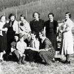 Photo 210.029.055, from the Clark Collection, courtesy of Hope and Sunrise Historical and Mining Museum 
Members of the Hope Homemakers Club pose for a circa 1940 group shot. Emma Clark, holding daughter Carla, is standing third from the left in the back row; Emmas older daughter Berdie is in front of her, sitting on the lap of an unidentified woman who is seated in the front row.