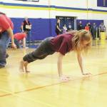 Grace Fleming of Seward competes in the seal hop Saturday, March 7, 2020 during the Kachemak Bay Traditional Games, a Native Youth Olympics invitational, at Homer High School in Homer, Alaska. (Photo by Megan Pacer/Homer News)