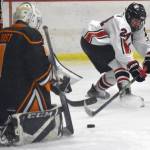 Kenai Centrals Avery Martin puts a shot on West goalie Michael Rust on Friday, Jan. 13, 2023, at the Kenai Multi-Purpose Facility in Kenai, Alaska. (Photo by Jeff Helminiak/Peninsula Clarion)