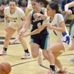 Nikiskis Savanna Stock and Kotzebues Zaina McConnell battle for the ball Saturday, Jan. 14, 2023, at the 34th Annual Rus Hitchcock Nikiski Tip Off Tournament at Nikiski High School in Nikiski, Alaska. (Photo by Jeff Helminiak/Peninsula Clarion)