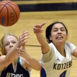 Nikiski's Avery White and Kotzebue's Zaina McConnell battle for the ball Saturday, Jan. 14, 2023, at the 34th Annual Rus Hitchcock Nikiski Tip Off Tournament at Nikiski High School in Nikiski, Alaska. (Photo by Jeff Helminiak/Peninsula Clarion)