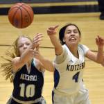 Nikiskis Avery White and Kotzebues Zaina McConnell battle for the ball Saturday, Jan. 14, 2023, at the 34th Annual Rus Hitchcock Nikiski Tip Off Tournament at Nikiski High School in Nikiski, Alaska. (Photo by Jeff Helminiak/Peninsula Clarion)