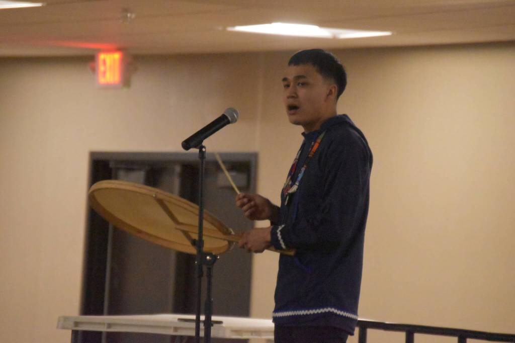 Byron Nicholai, of I Sing, You Dance, sings and drums during a musical performance as part of the Kahtnuhtana Hey Chiula NYO Invitational on Saturday, Jan. 14, 2023, at the Kahtnuhtana Duhdeldiht Campus in Kenai, Alaska. (Jake Dye/Peninsula Clarion)