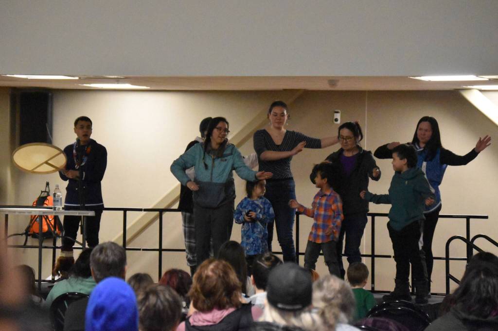 Byron Nicholai, of I Sing, You Dance, is joined on stage by members of the audience during a musical performance as part of the Kahtnuhtana Hey Chiula NYO Invitational on Saturday, Jan. 14, 2023, at the Kahtnuhtana Duhdeldiht Campus in Kenai, Alaska. (Jake Dye/Peninsula Clarion)
