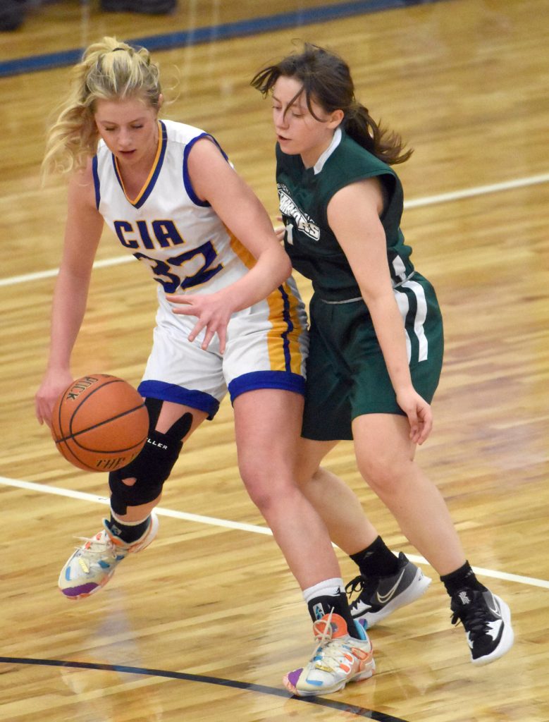Cook Inlet Academys Tatum Rozak dribbles against Birchwood Christians Eden Becker on Saturday, Jan. 21, 2023, at Cook Inlet Academy near Soldotna, Alaska. (Photo by Jeff Helminiak/Peninsula Clarion)