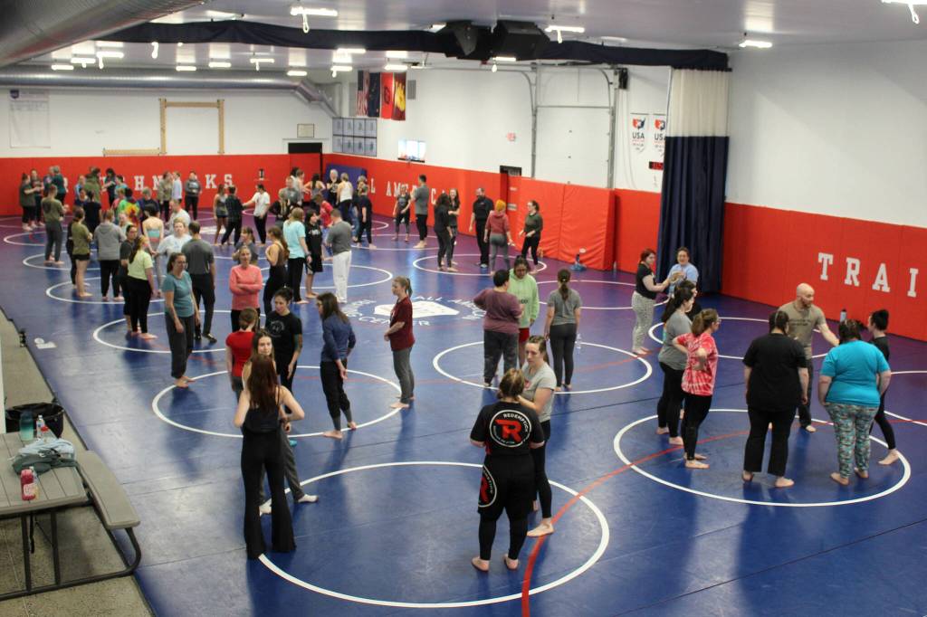 Women learn defensive maneuvers at a Toss A Cop event at the All American Training Center on Saturday, Jan. 21, 2023, in Soldotna, Alaska. (Ashlyn OHara/Peninsula Clarion)
