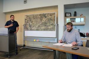 Soldotna Public Works Director Kyle Kornelis (right) answers questions from Jeff Dolifka (left) regarding the Soldotna Field House on Tuesday, Sept. 13, 2022, in Soldotna, Alaska. (Ashlyn OHara/Peninsula Clarion)