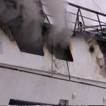 Smoke emerges from R/V Qualifier, which caught on fire in the Northern Enterprises Boatyard on Kachemak Drive, Jan. 19.
