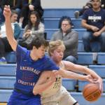 JD McGee of Anchorage Christian Schools knocks the ball away from Soldotnas Jakob Brown on Wednesday, Jan. 25, 2023, at Soldotna High School in Soldotna, Alaska. (Photo by Jeff Helminiak/Peninsula Clarion)