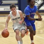 Soldotnas Zac Buckbee brings the ball up under pressure from Darian Kwacho of Anchorage Christian Schools on Wednesday, Jan. 25, 2023, at Soldotna High School in Soldotna, Alaska. (Photo by Jeff Helminiak/Peninsula Clarion)