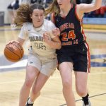 Soldotnas Tanner Inman drives on Mila Hargrave of Juneau-Douglas on Thursday, Jan. 26, 2023, at the Al Howard Tournament at Soldotna High School in Soldotna, Alaska. (Photo by Jeff Helminiak/Peninsula Clarion)
