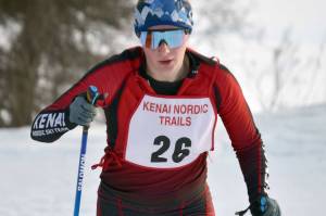 Kenai Central's Emily Moss rounds a corner at the Kenai Pursuit on Friday, Jan. 27, 2023, at Tsalteshi Trails just outside of Soldotna, Alaska. (Photo by Jeff Helminiak/Peninsula Clarion)