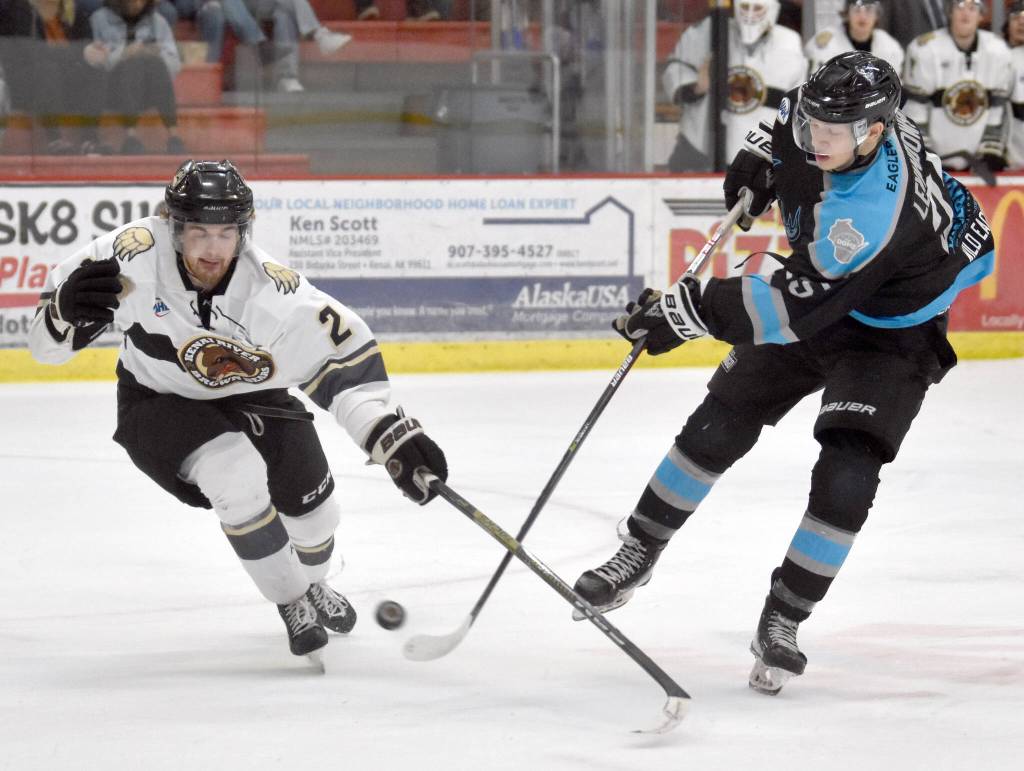 Kenai River defenseman Luke Anderson blocks a shot by Wisconsin Windigo forward Luke Levandowski on Saturday, Jan. 28, 2023, at the Soldotna Regional Sports Complex in Soldotna, Alaska. (Photo by Jeff Helminiak/Peninsula Clarion)