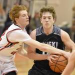 Kenai Centrals Wade James tries to steal the ball from Nikiskis Braeden Porter on Tuesday, Jan. 31, 2023, at Kenai Central High School in Kenai, Alaska. (Photo by Jeff Helminiak/Peninsula Clarion)