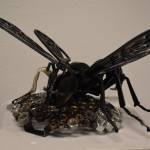 A bee crafted of metal sits atop a honeycomb of hexnuts on Tuesday, Jan. 31, 2023, at the Kenai Art Center, in Kenai, Alaska, as part of Metalwork & Play. (Jake Dye/Peninsula Clarion)