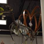 A metal dog created by Dave Emery stands tall, clutching a tennis ball in its mouth Tuesday, Jan. 31, 2023, at the Kenai Art Center, in Kenai, Alaska, as part of Metalwork & Play. (Jake Dye/Peninsula Clarion)