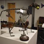 A metal dog created by Dave Emery stands alongside other metal creations on Tuesday, Jan. 31, 2023, at the Kenai Art Center, in Kenai, Alaska, as part of Metalwork & Play. (Jake Dye/Peninsula Clarion)