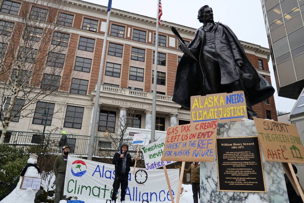 Climate activists hold a rally outside the Alaska State Capitol on Friday, Feb. 3, 2023, to advocate for legislative action to improve Alaskas renewable energy development and future sustainability. (Clarise Larson / Juneau Empire)