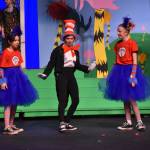 The cast of Triumvirate Theatres production of Seussical, portraying The Cat in the Hat, Thing 1 and Thing 2 rehearse on Wednesday, Feb. 8, 2023, in the Renee C. Henderson Auditorium at Kenai Central High School in Kenai, Alaska. (Jake Dye/Peninsula Clarion)