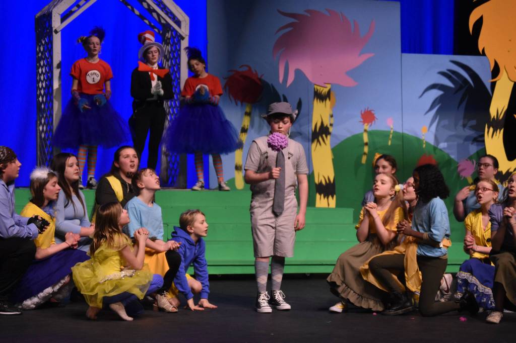 Bowe Meyers, as Horton, and the cast of Triumvirate Theatres production of Seussical rehearse on Wednesday, Feb. 8, 2023, in the Renee C. Henderson Auditorium at Kenai Central High School in Kenai, Alaska. (Jake Dye/Peninsula Clarion)