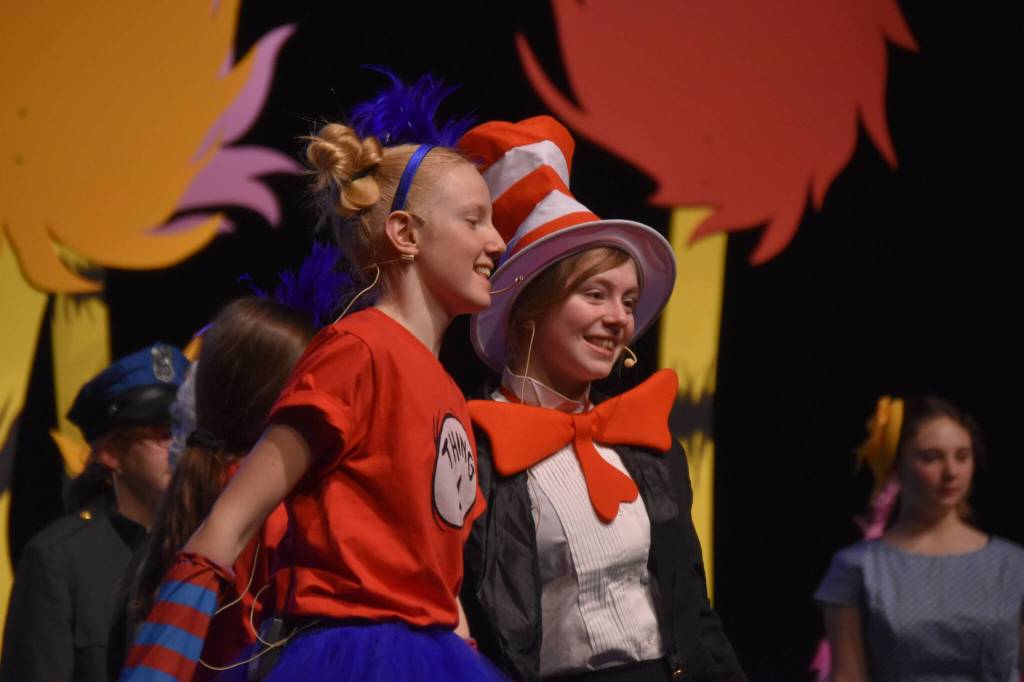 The cast of Triumvirate Theatres production of Seussical, portraying Thing 1 and The Cat in the Hat rehearse on Wednesday, Feb. 8, 2023, in the Renee C. Henderson Auditorium at Kenai Central High School in Kenai, Alaska. (Jake Dye/Peninsula Clarion)