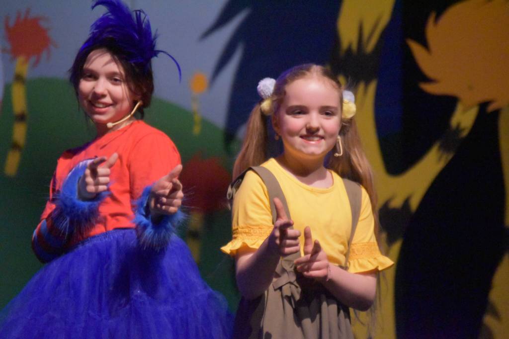 Morgan Hooper (right) and another member of Triumvirate Theatres production of Seussical rehearse on Wednesday, Feb. 8, 2023, in the Renee C. Henderson Auditorium at Kenai Central High School in Kenai, Alaska. (Jake Dye/Peninsula Clarion)