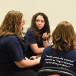 Leihla Harrison, Lyndzi Gaucin and Emma Knowles discuss their response to a question during Kenai Peninsula Borough School District High School Battle of the Books Final on Tuesday, Feb. 7, 2023 at Soldotna High School in Soldotna, Alaska. (Jake Dye/Peninsula Clarion)