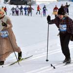 Gigi Banas and Sue Seggerman ski at the 19th annual Ski For Women on Sunday, Feb. 12, 2023, at Tsalteshi Trails just outside of Soldotna, Alaska. The two, with Banas as Grandma and Seggerman as the Woodcutter, were part of the winning costume of Little Red Riding Hood and the Big Bad Wolf. Not pictured, Leslie Boyd was Little Red Riding Hood and Sara Mahood was the Wolf. (Photo by Jeff Helminiak/Peninsula Clarion)