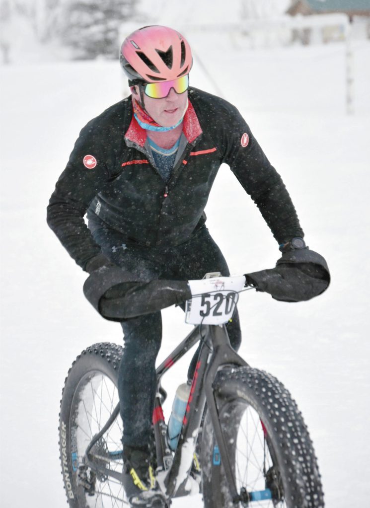 Photo by Jeff Helminiak/Peninsula Clarion 
Eric Thomason finishes first in the mens 20-kilometer fat bike at the 6th Annual Tour of Tsalteshi on Sunday, at Tsalteshi Trails just outside of Soldotna.