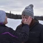 Pastor Karen Martin Tichenor applies ashes to Pastor Meredith Harbers forehead as they prepare for Ashes to Go! on Wednesday; Feb. 22; 2023 at Soldotna Creek Park in Soldotna; Alaska. (Jake Dye/Peninsula Clarion)